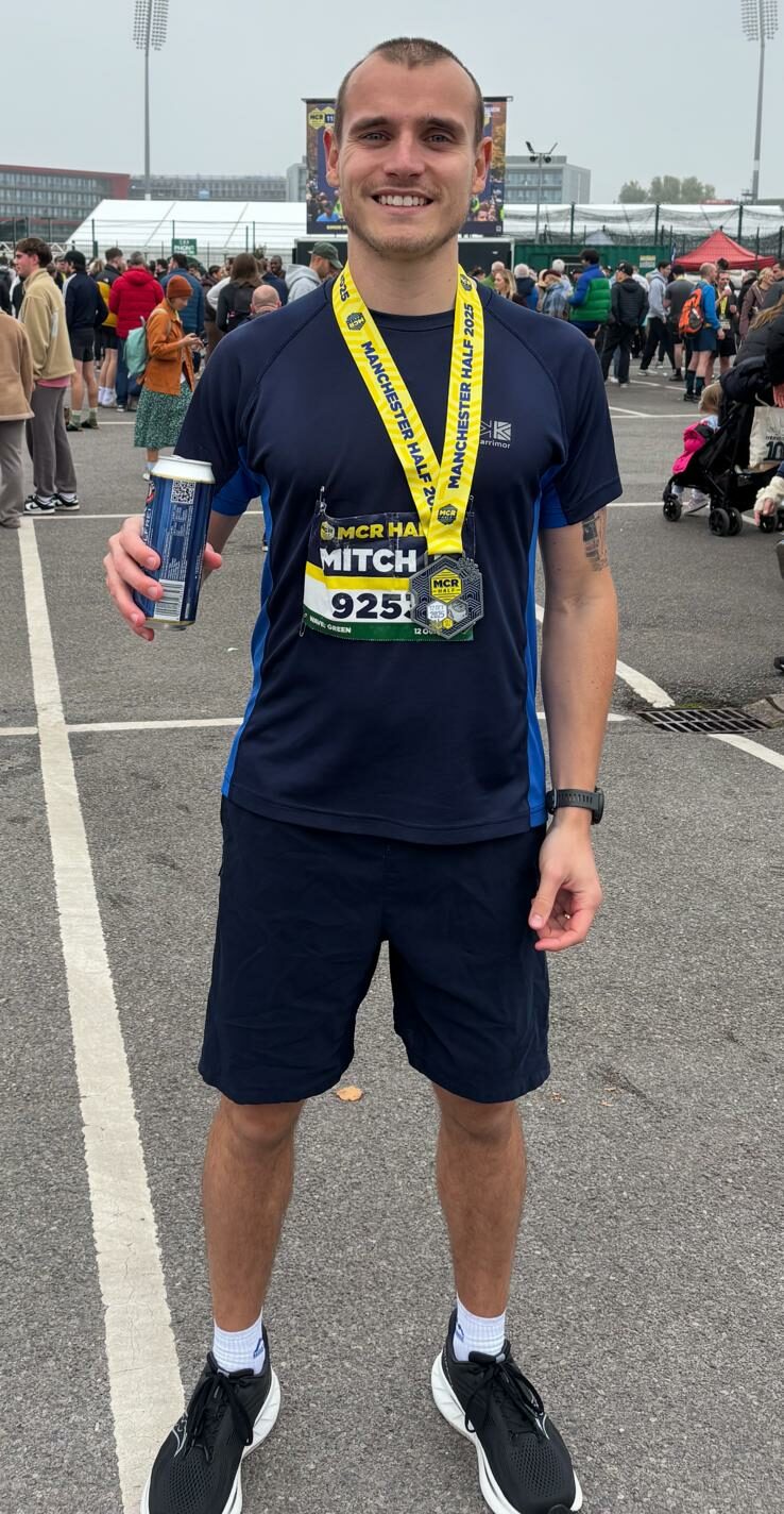 Mitch holding a drink after a race