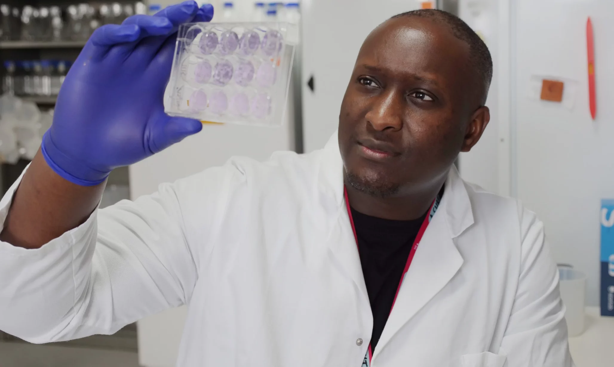Researcher holding samples homepage banner