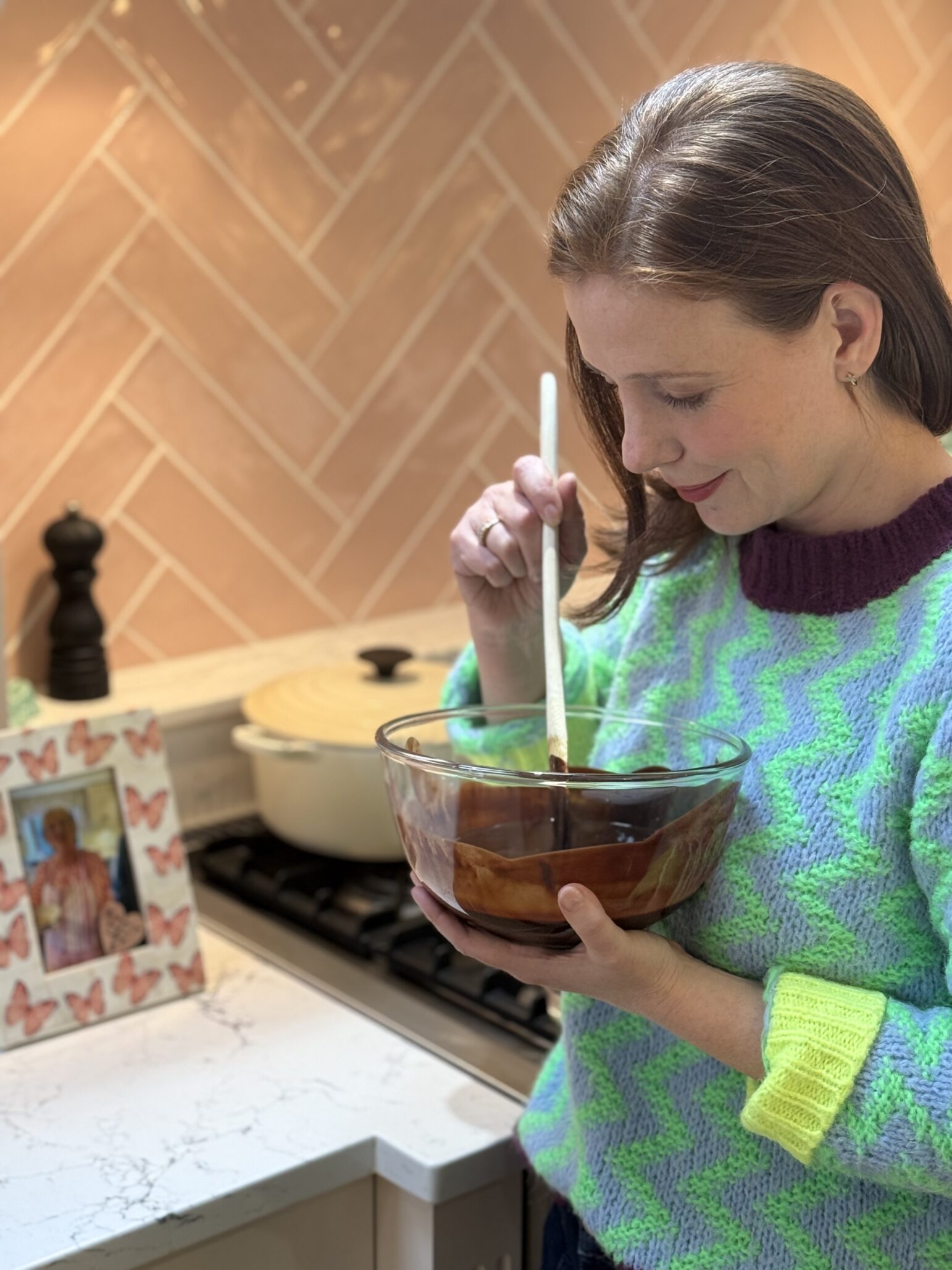 Amy Nuttall baking, stirring a bowl of batter