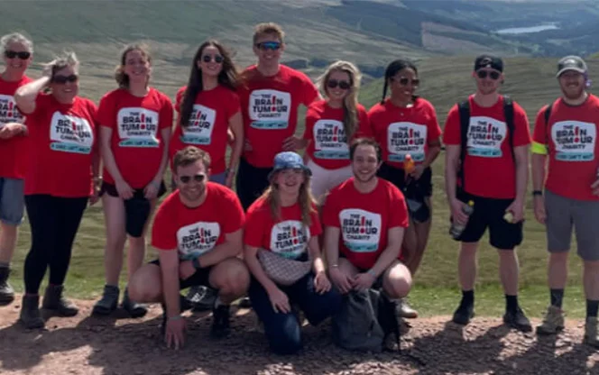 A group of people wearing The Brain Tumour Charity t-shirts during a corporate partnership event