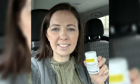 Sally Penny holding her vorasidenib tablets