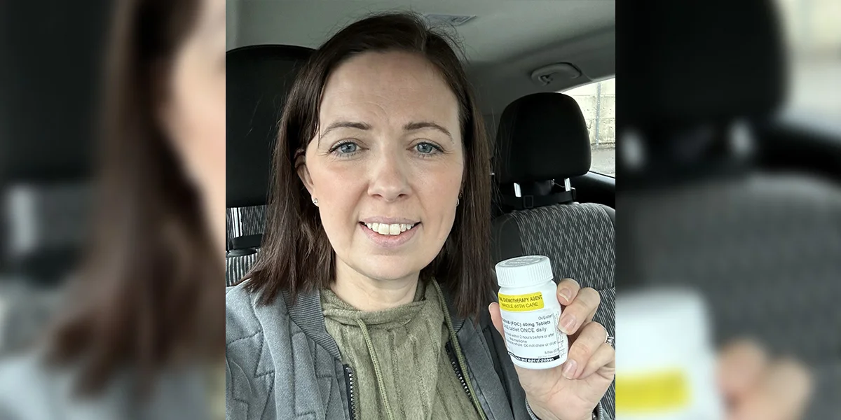 Sally Penny holding her vorasidenib tablets