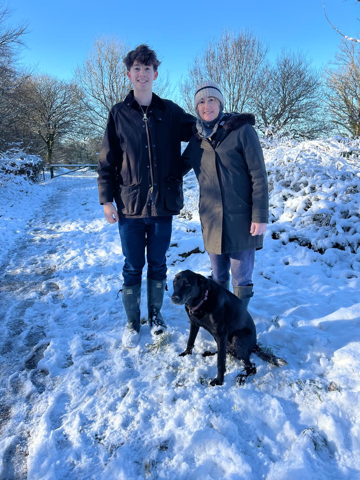 Oscar and Sophie Kinsella with their dog in the snow