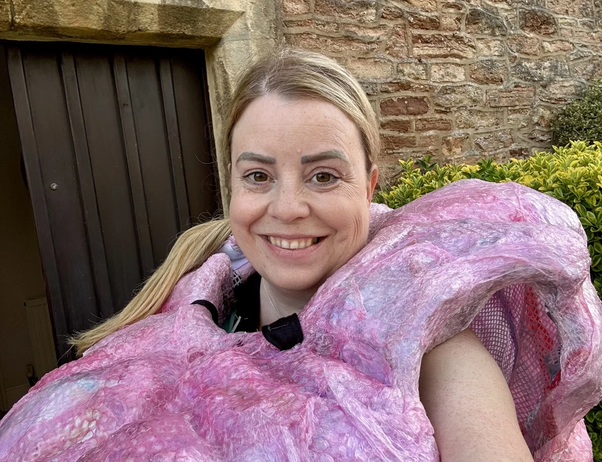 A close up of Jane Roberts wearing a brain costume. Jane will run a half marathon dressed as a brain to raise funds and awareness