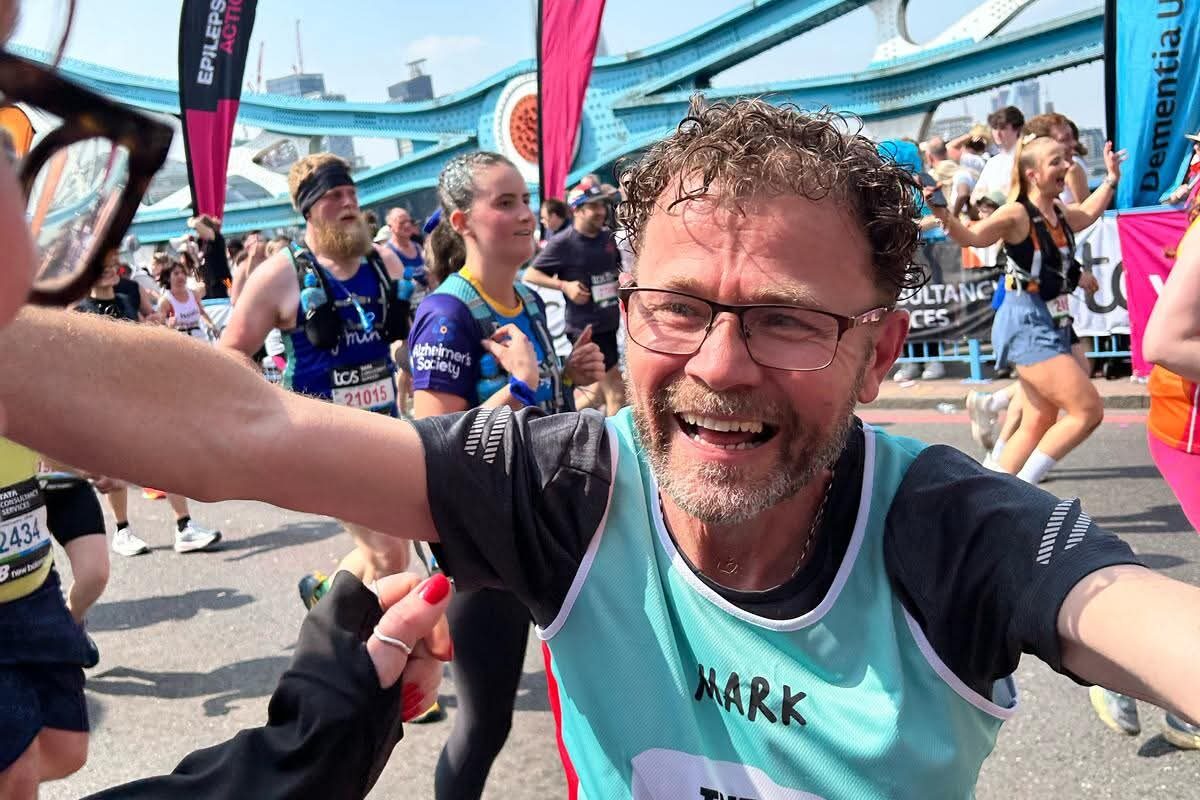 Mark in The Brain Tumour Charity running vest during a marathon
