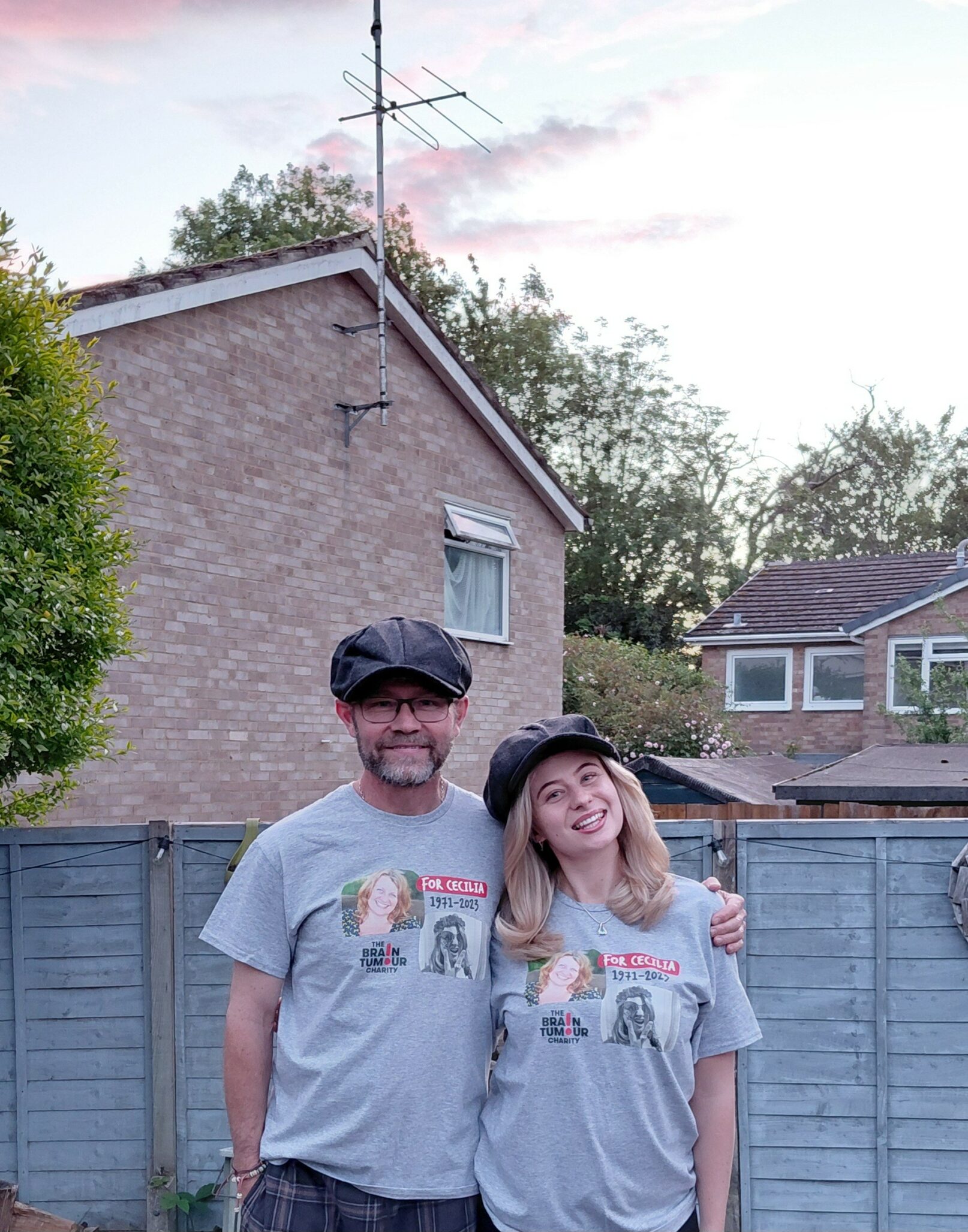 Mark with daughter Amelia, wearing their peaked caps in memory of Cecilia
