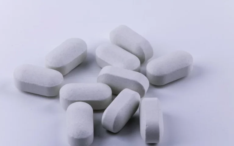 Vorasidenib (VORANIGO™) tablets on a white surface