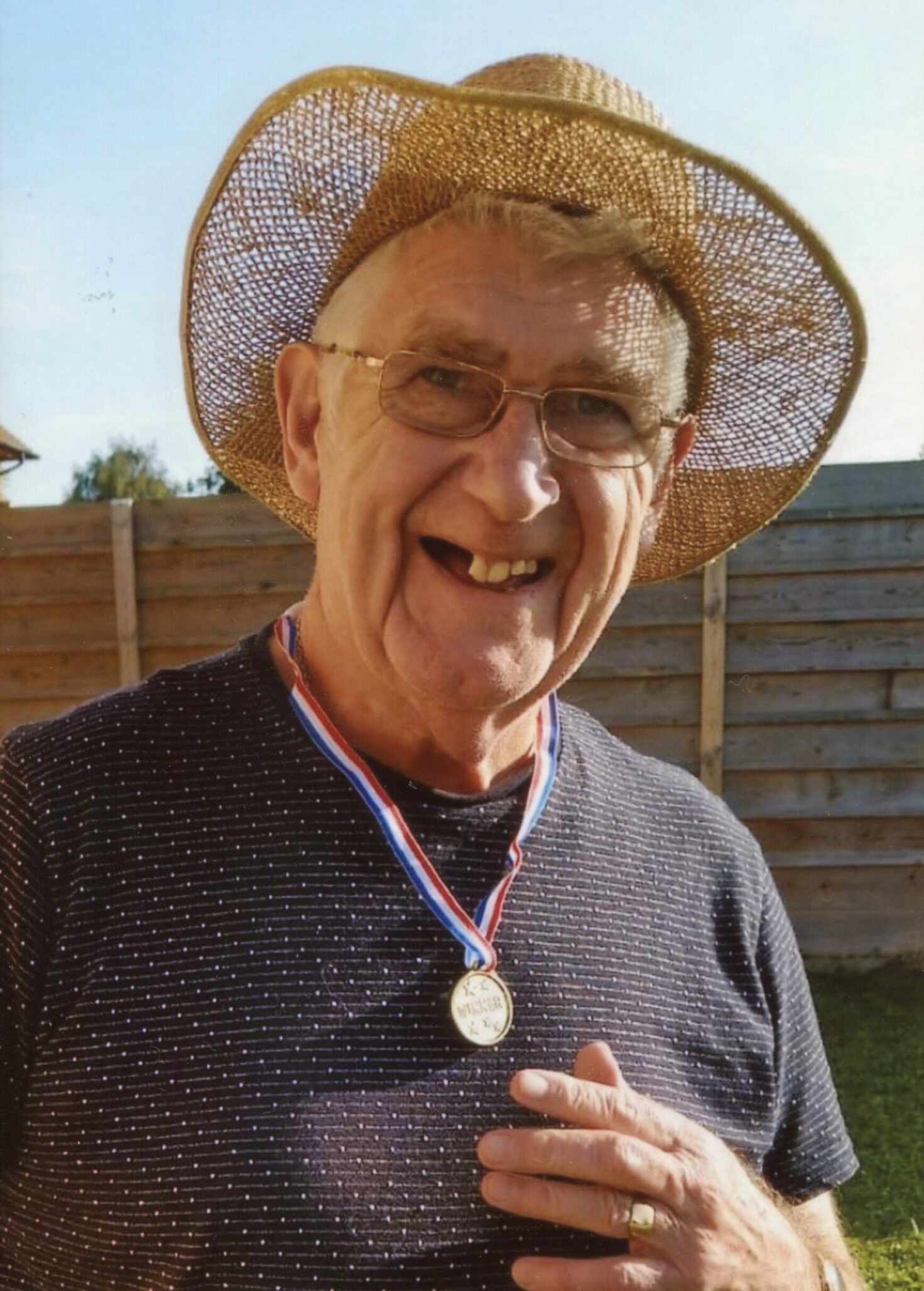 Brian Whiting outdoors wearing a sun hat