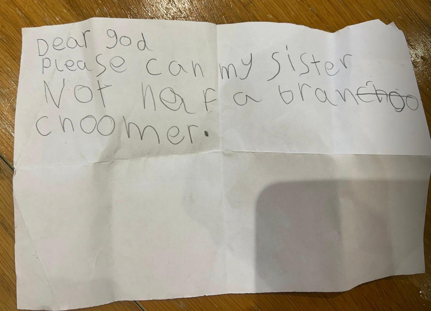 A letter written in a child's handwriting that reads: "Dear God, please can my sister not have a brain tumour"