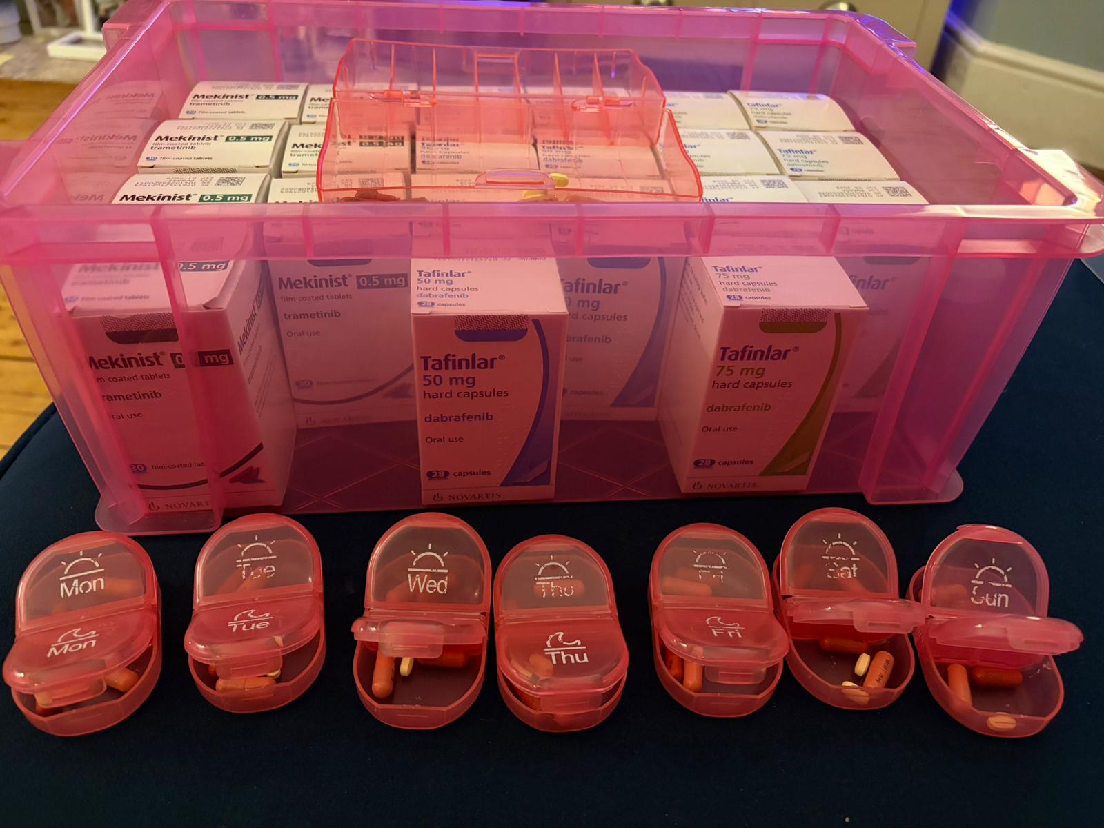 A pink box filled with targeted therapy drugs for brain tumours